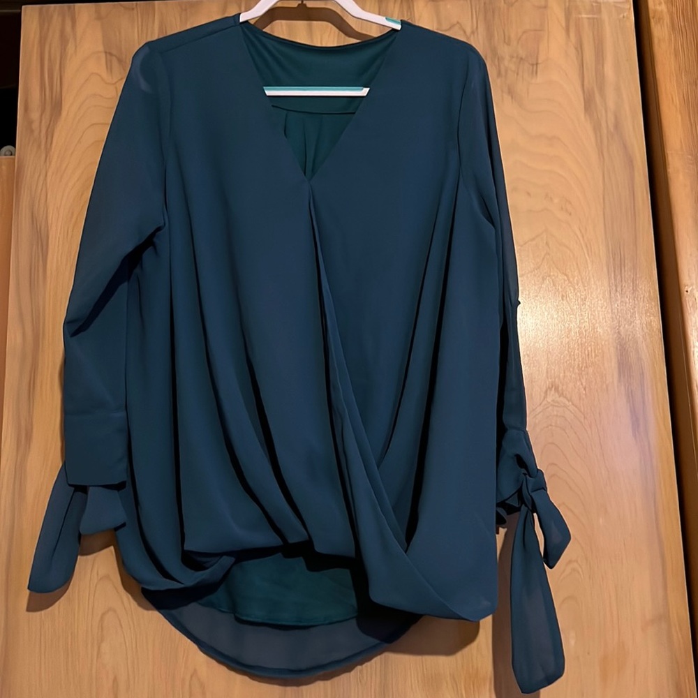 Hi low blouse. Long sleeve. Sleeves have a tie at the cuff